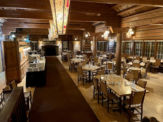 A warm, inviting dining area of Hotel Lakhadatar with traditional decor and happy guests enjoying meals.