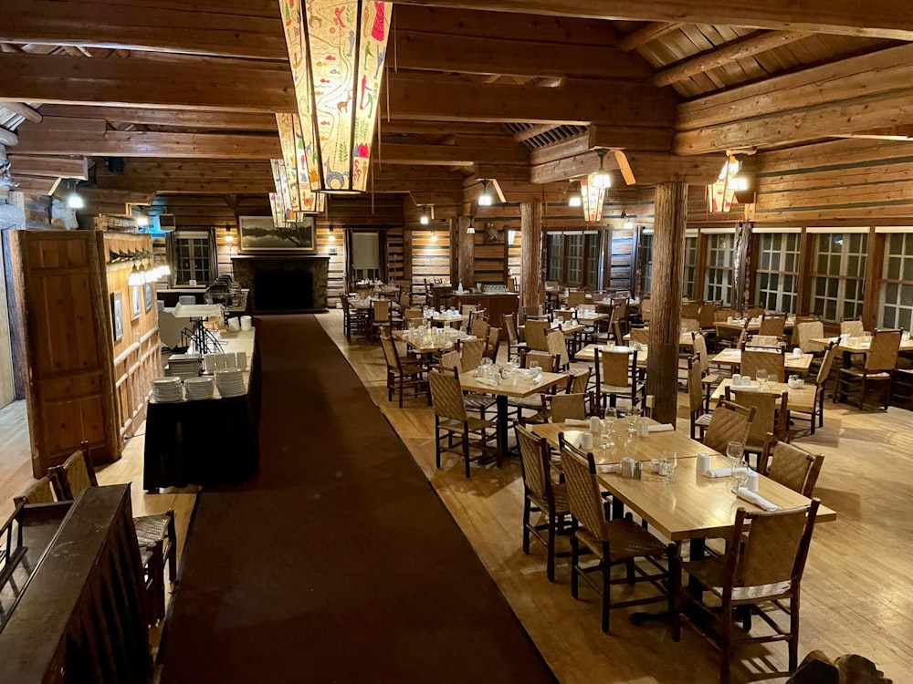 a restaurant with wooden walls and tables and chairs