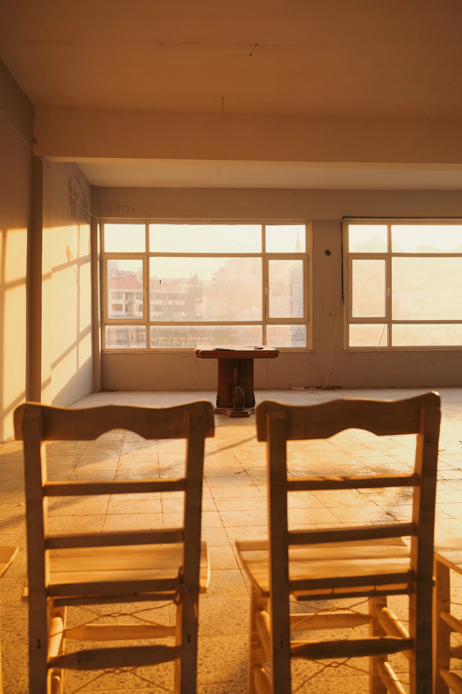 Two wooden chairs facing each other in a quiet room