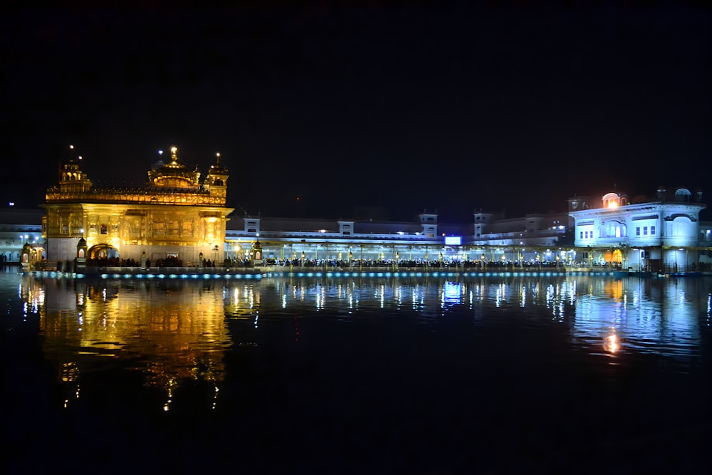 a large body of water with a building in the background