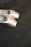 Close-up of shiny, elegant dance shoes on a polished wooden floor with gentle spotlight.