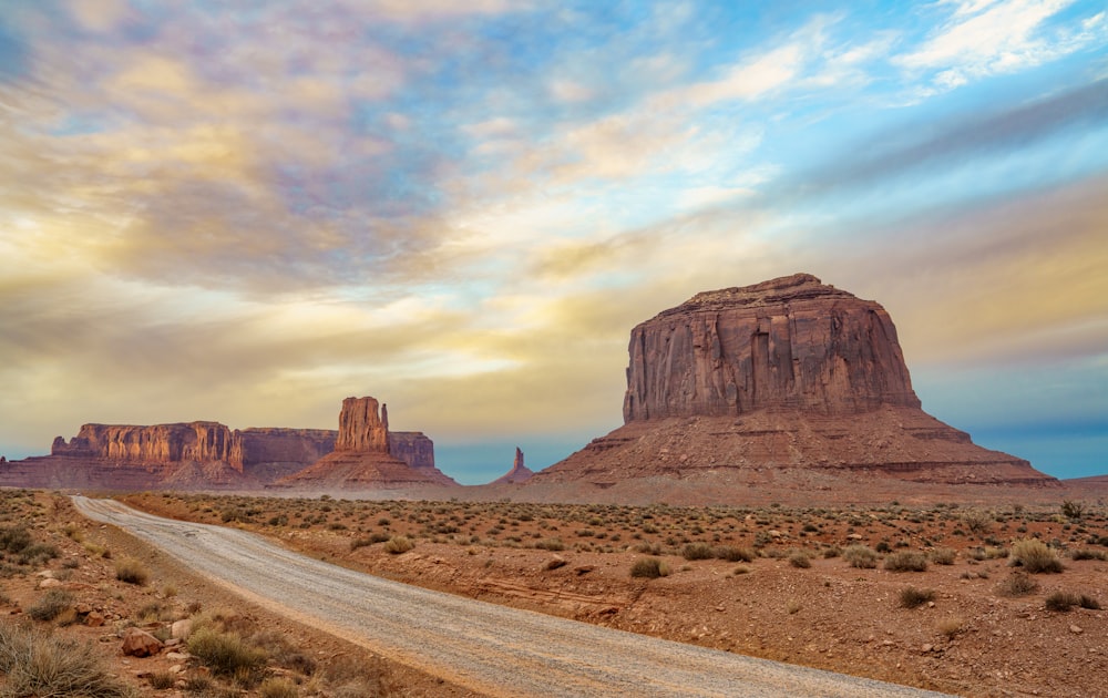 a dirt road in the middle of a desert