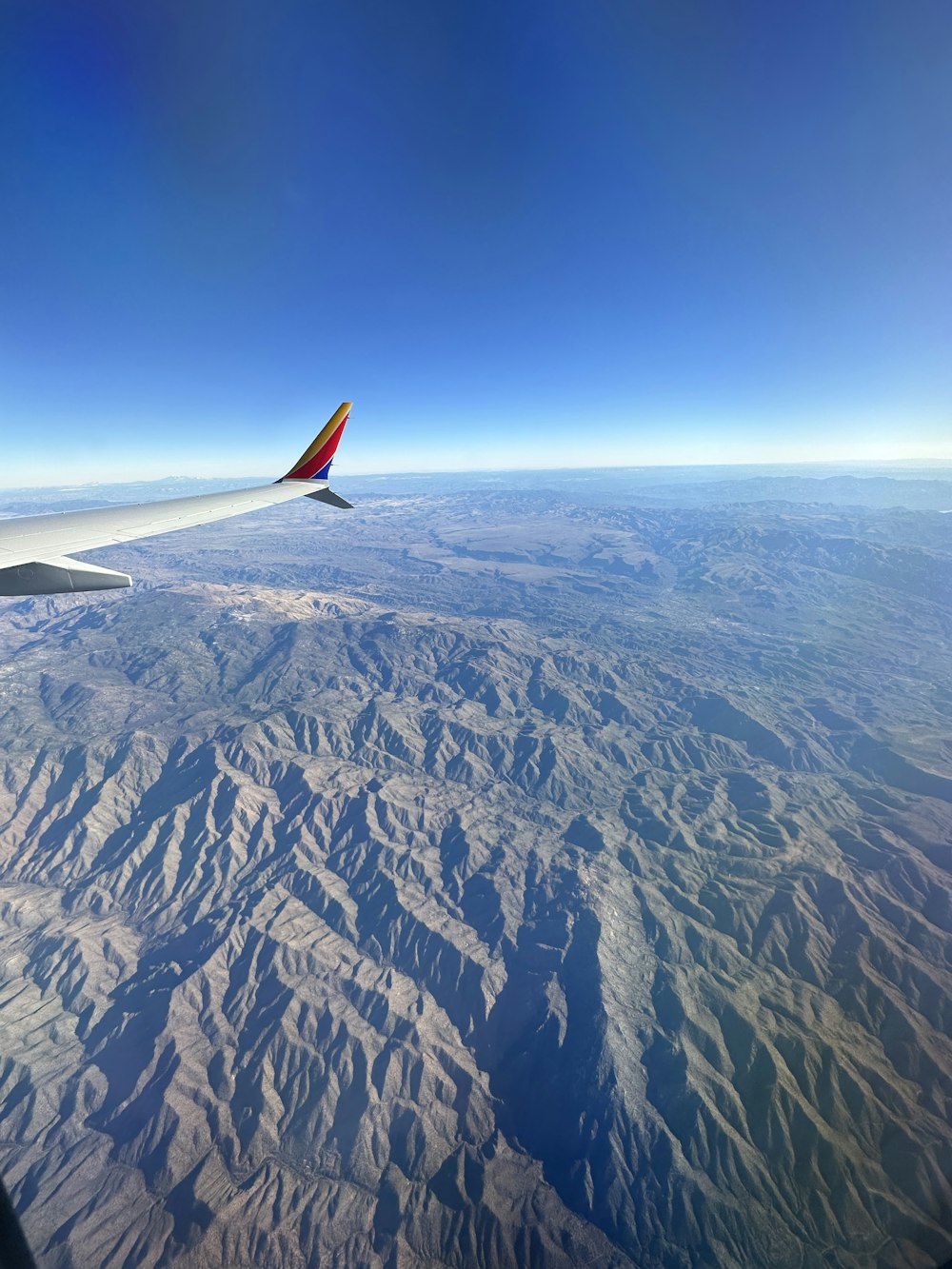 a view of a mountain range from an airplane