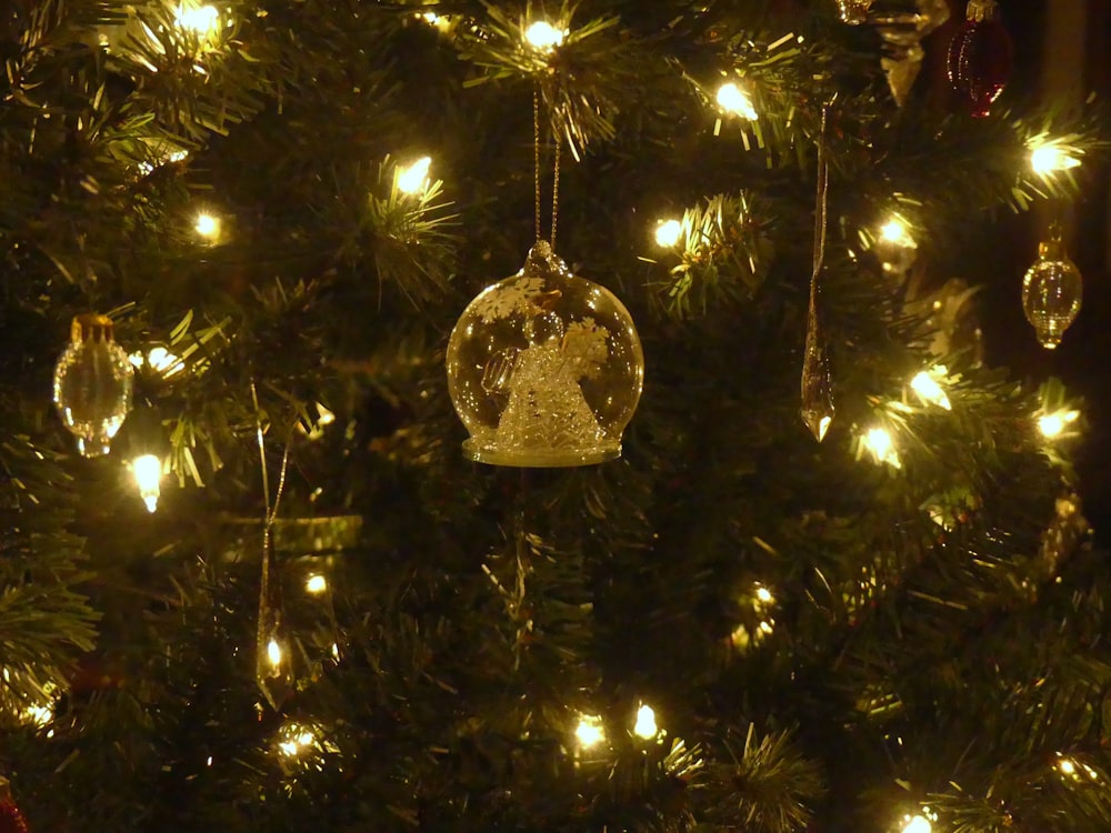 a close up of a christmas tree with lights