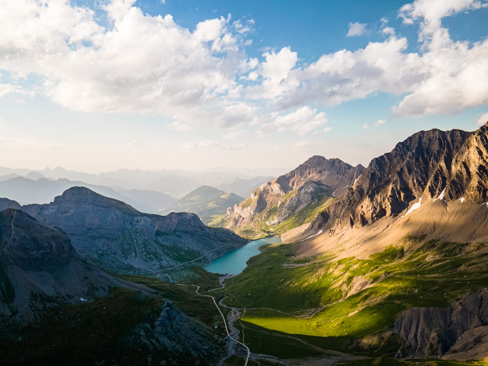 a view of a mountain range with a lake in the middle