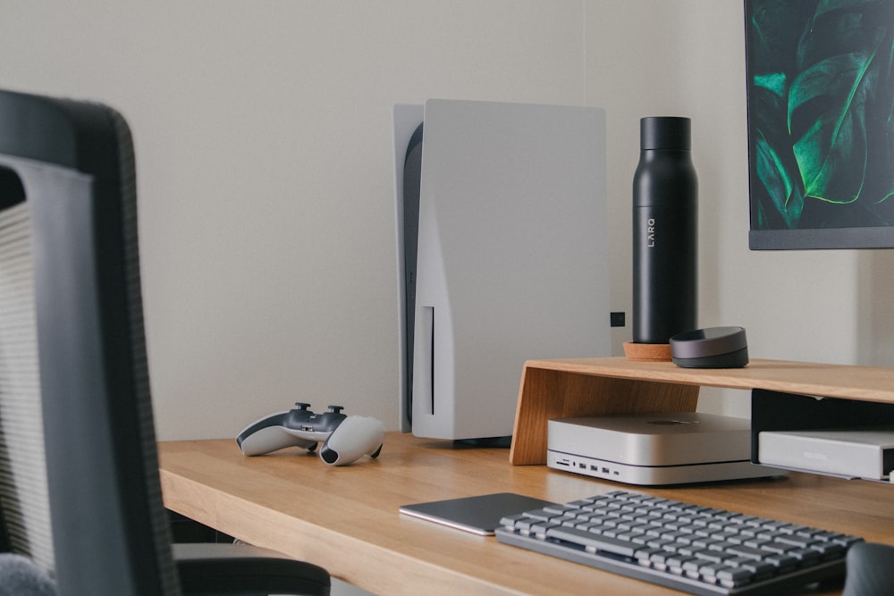 a computer desk with a keyboard, mouse and monitor