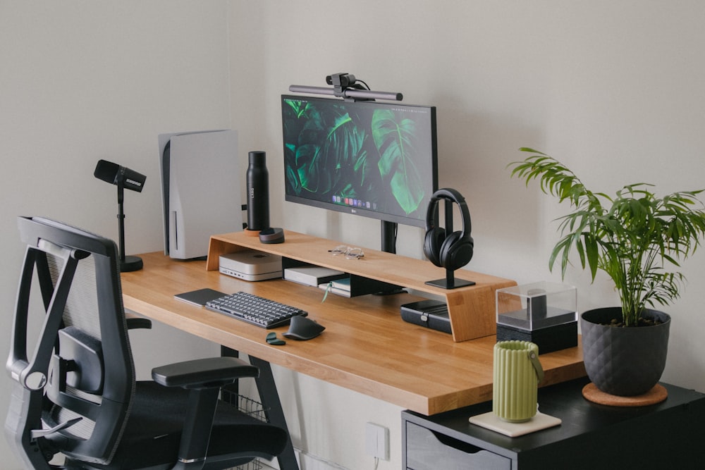 a computer desk with a monitor and keyboard