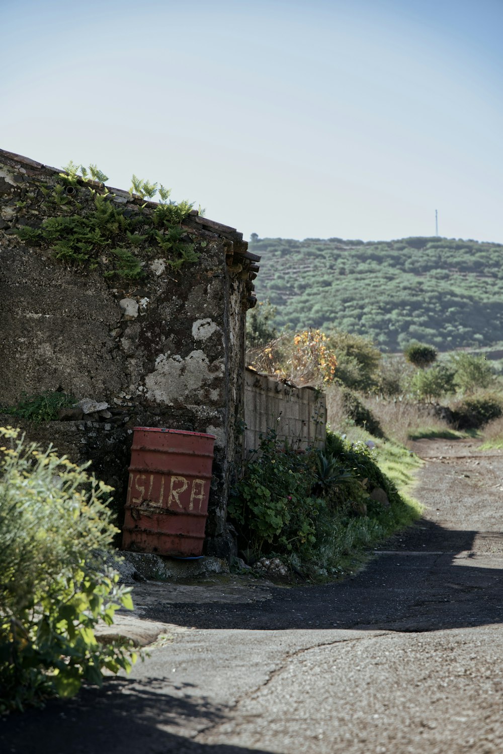 a red sign sitting on the side of a road