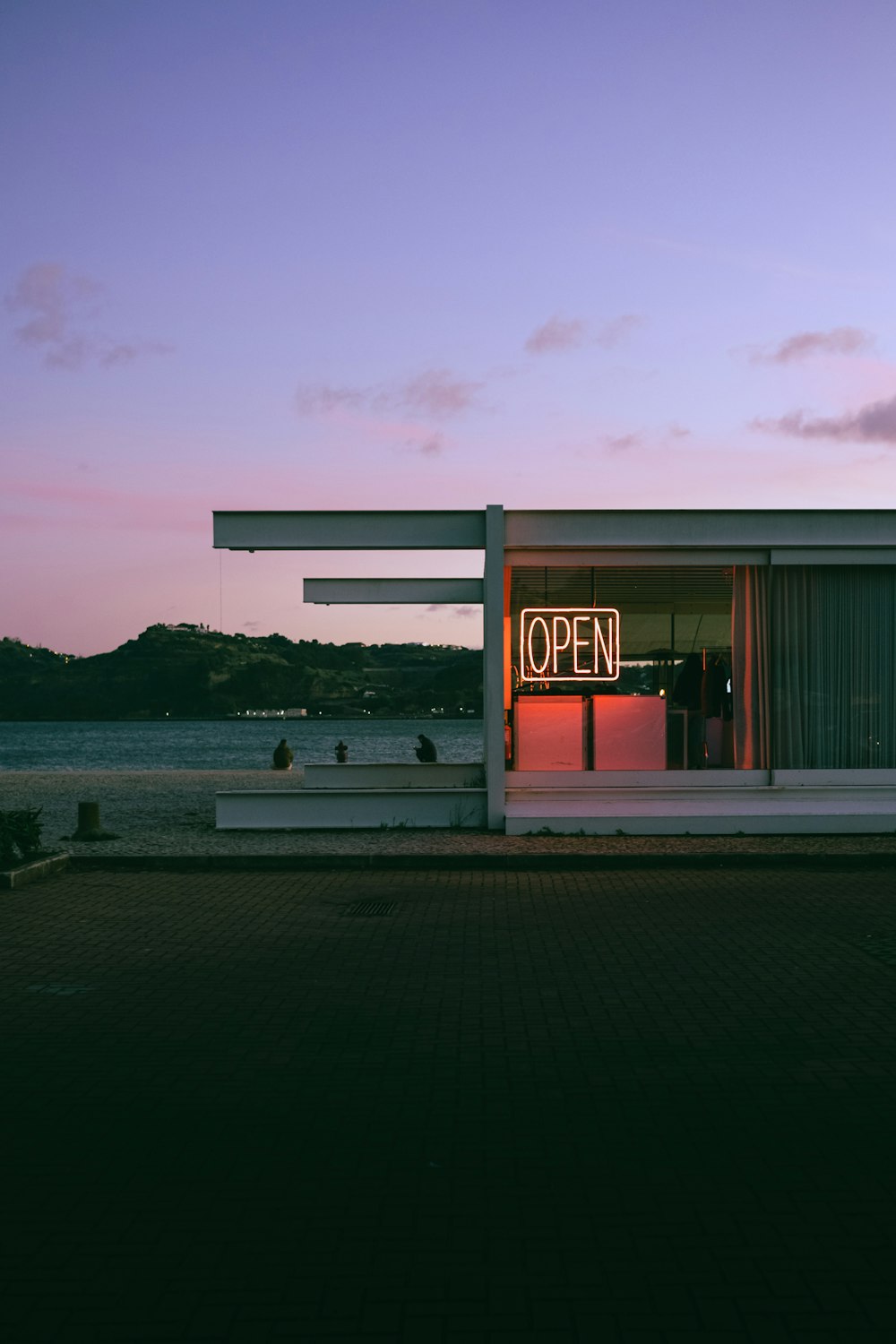 a building with a sign that says open on it