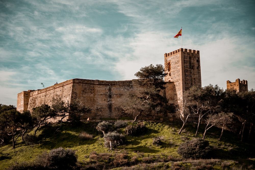 a castle with a flag on top of it