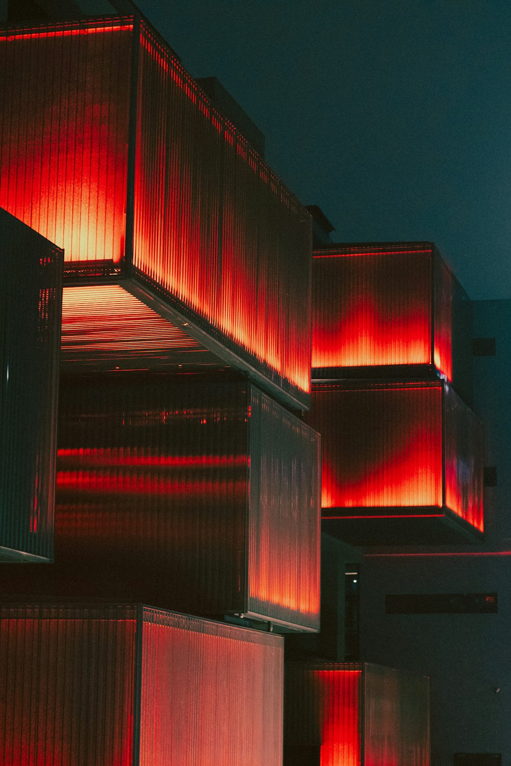 a stack of red boxes sitting next to each other