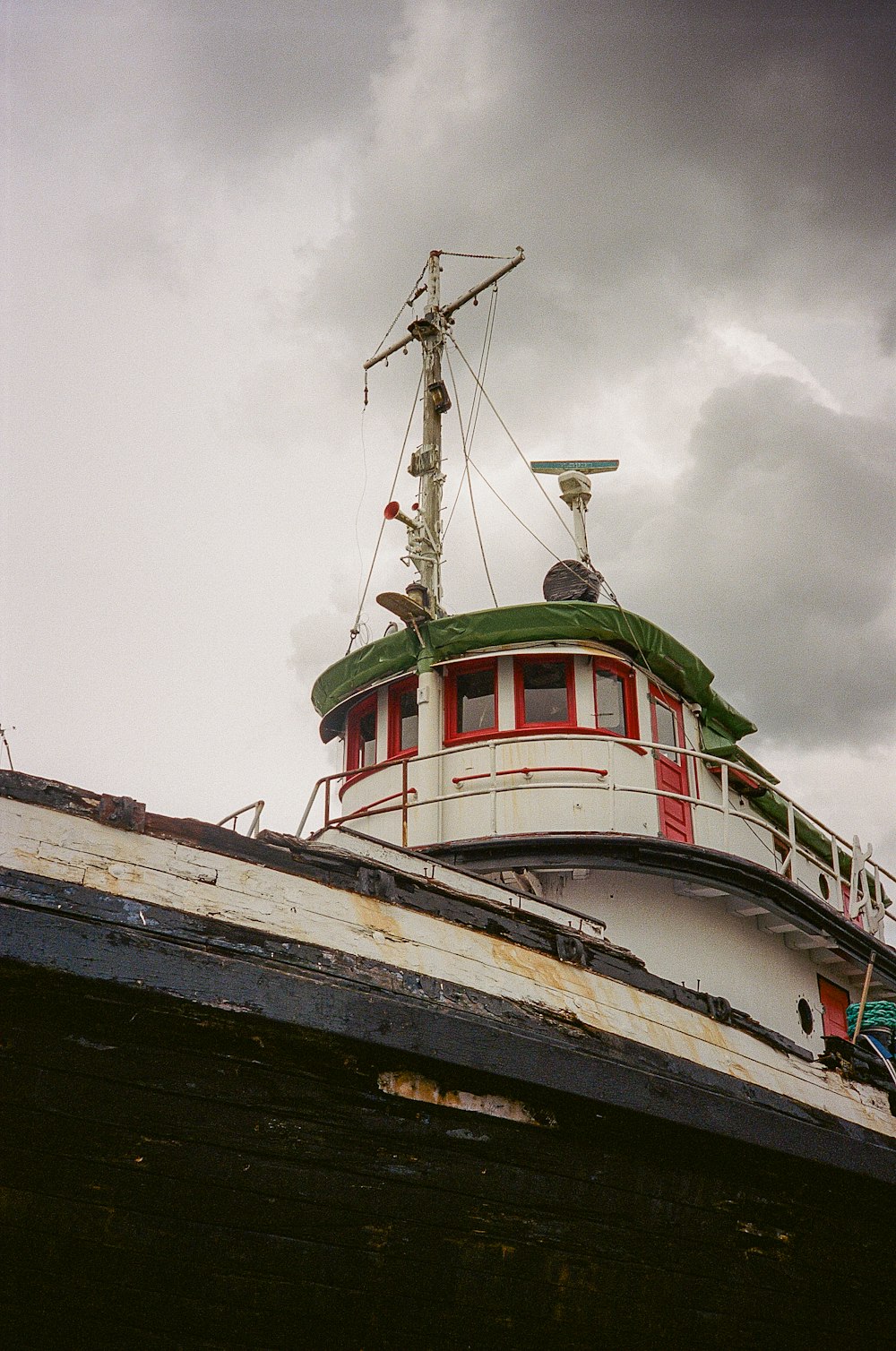 a boat sitting on top of a wooden dock