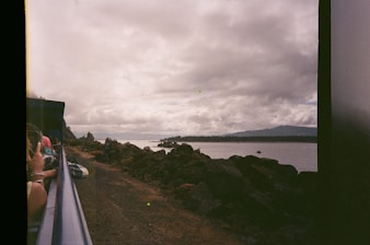 A diverse group of travelers enjoying a scenic coastal tour