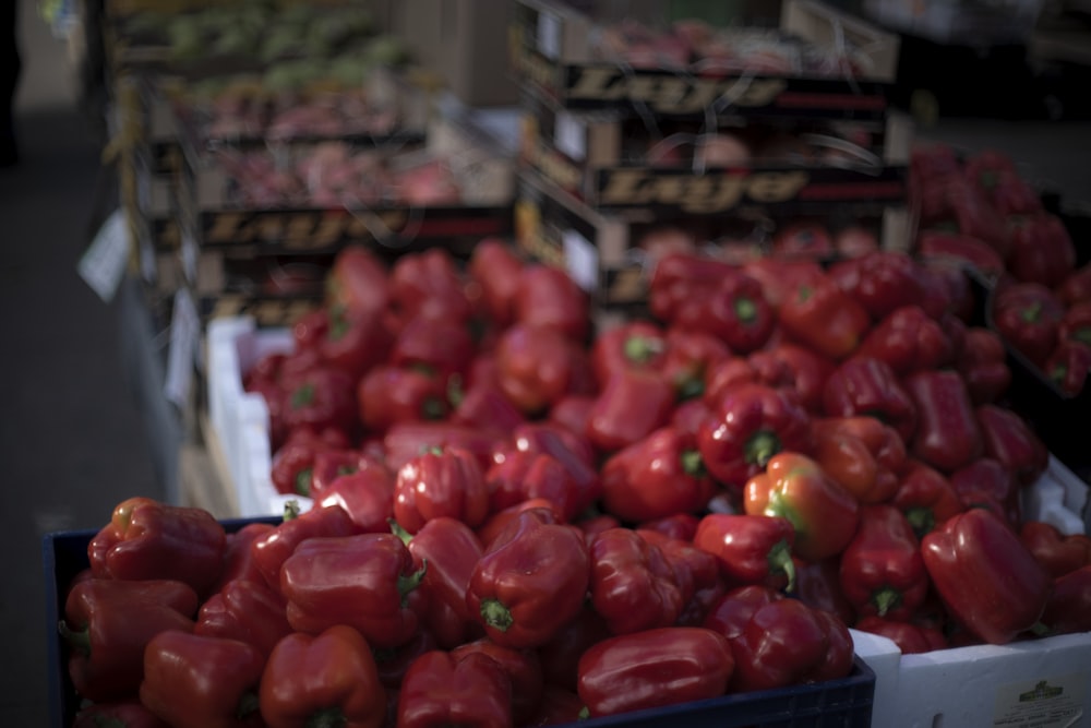 a bunch of red peppers sitting on a table