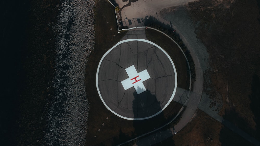 an aerial view of a cross painted on the ground