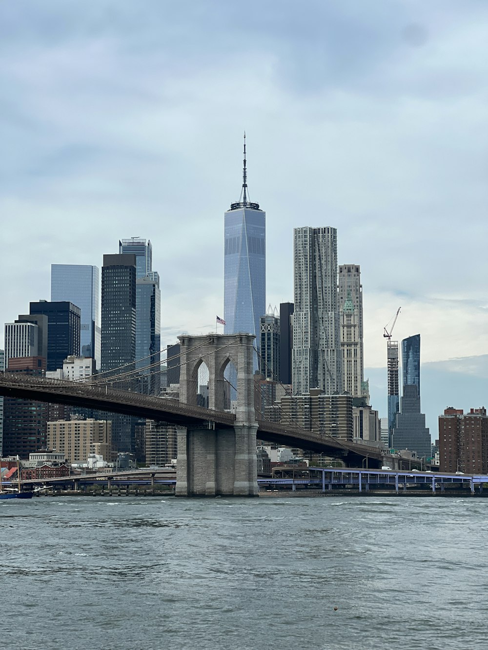 a view of a bridge in the middle of a city