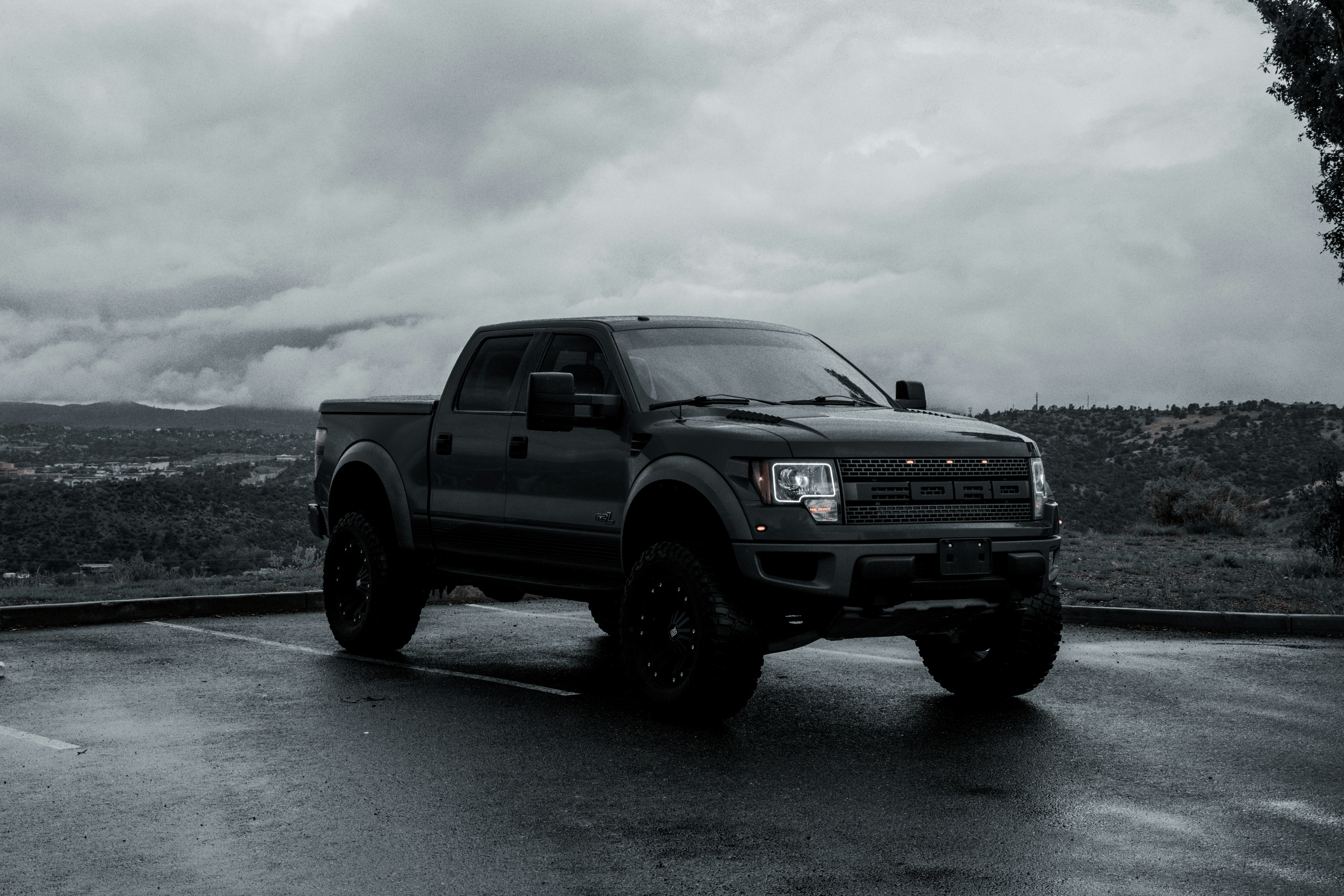 a black truck parked in a parking lot