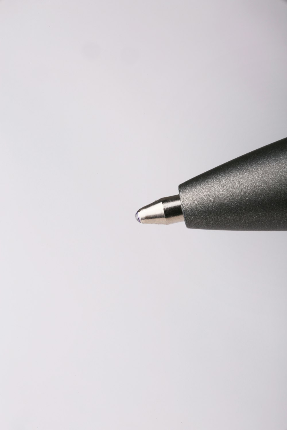 a close up of a pen with a white background