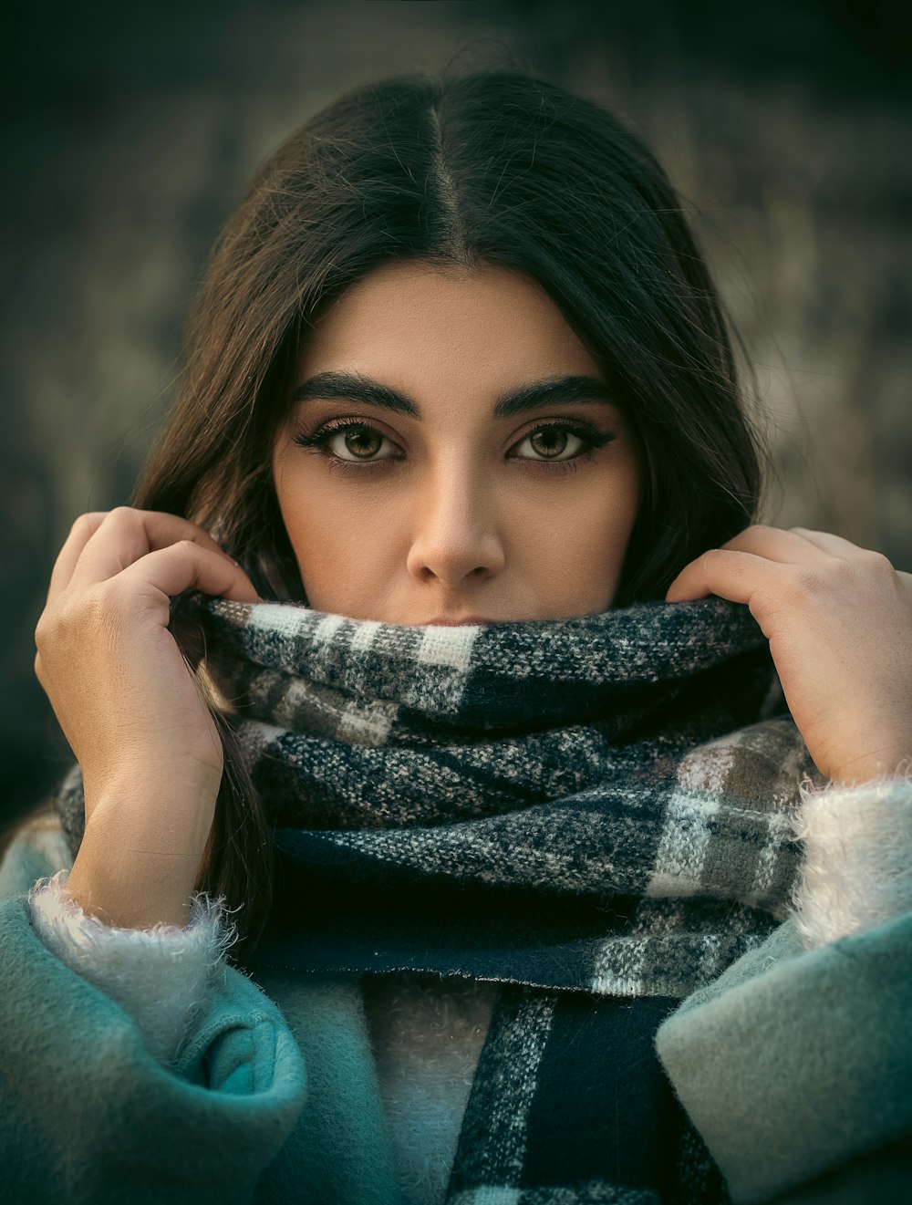 a woman with a scarf around her neck