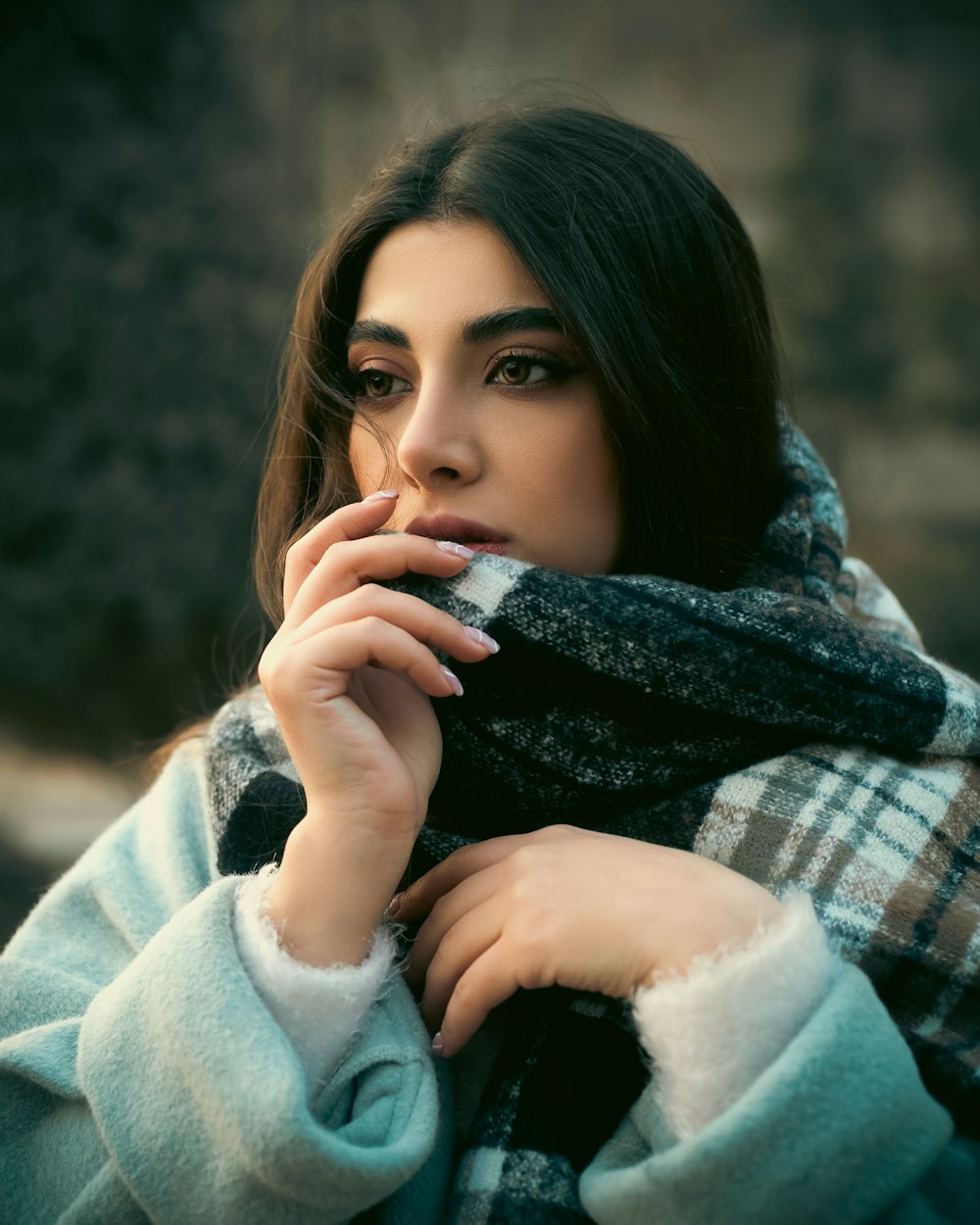 a woman with a scarf around her neck