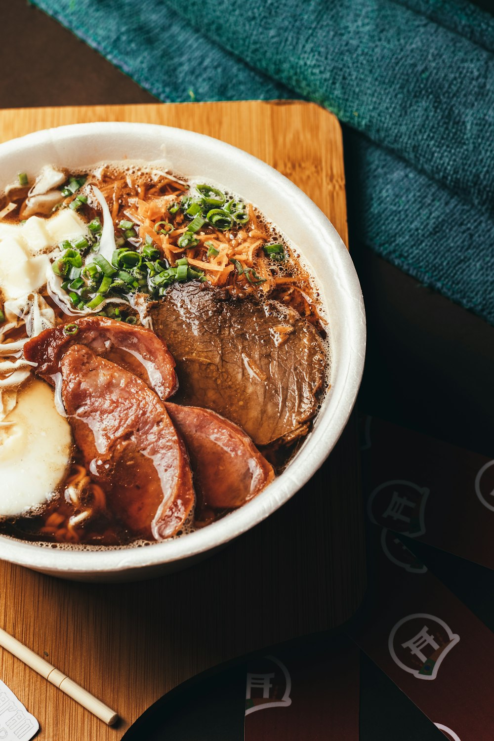 a bowl of food on a wooden table