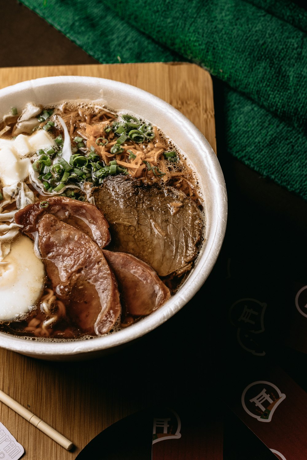 a bowl of food on a wooden table