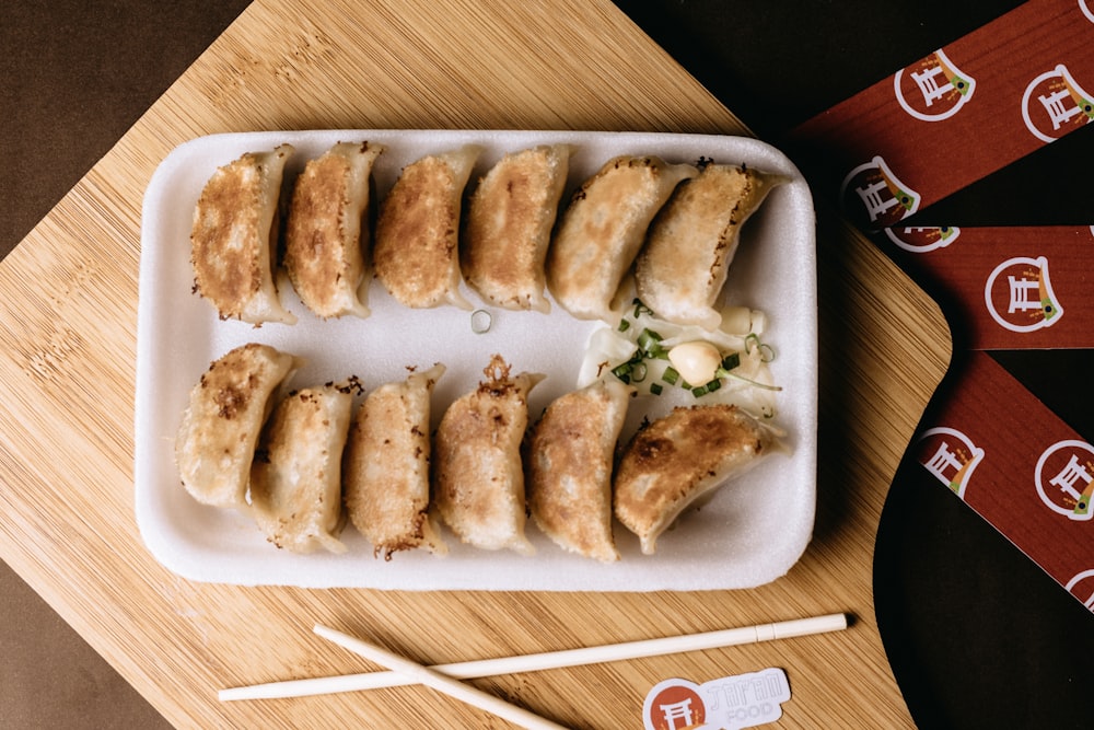 a plate of food with chopsticks on a table