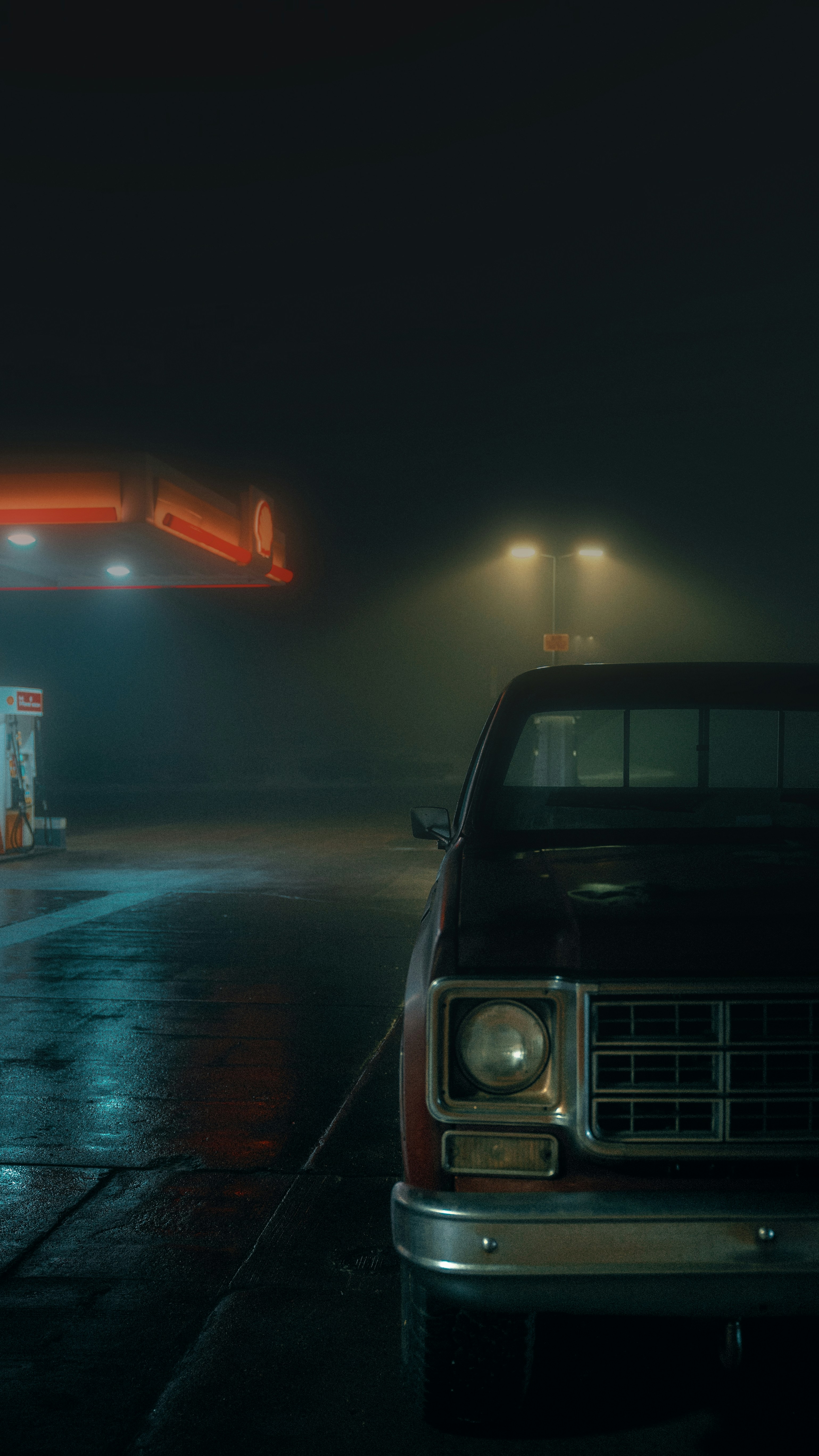 a car parked in a parking lot next to a gas station