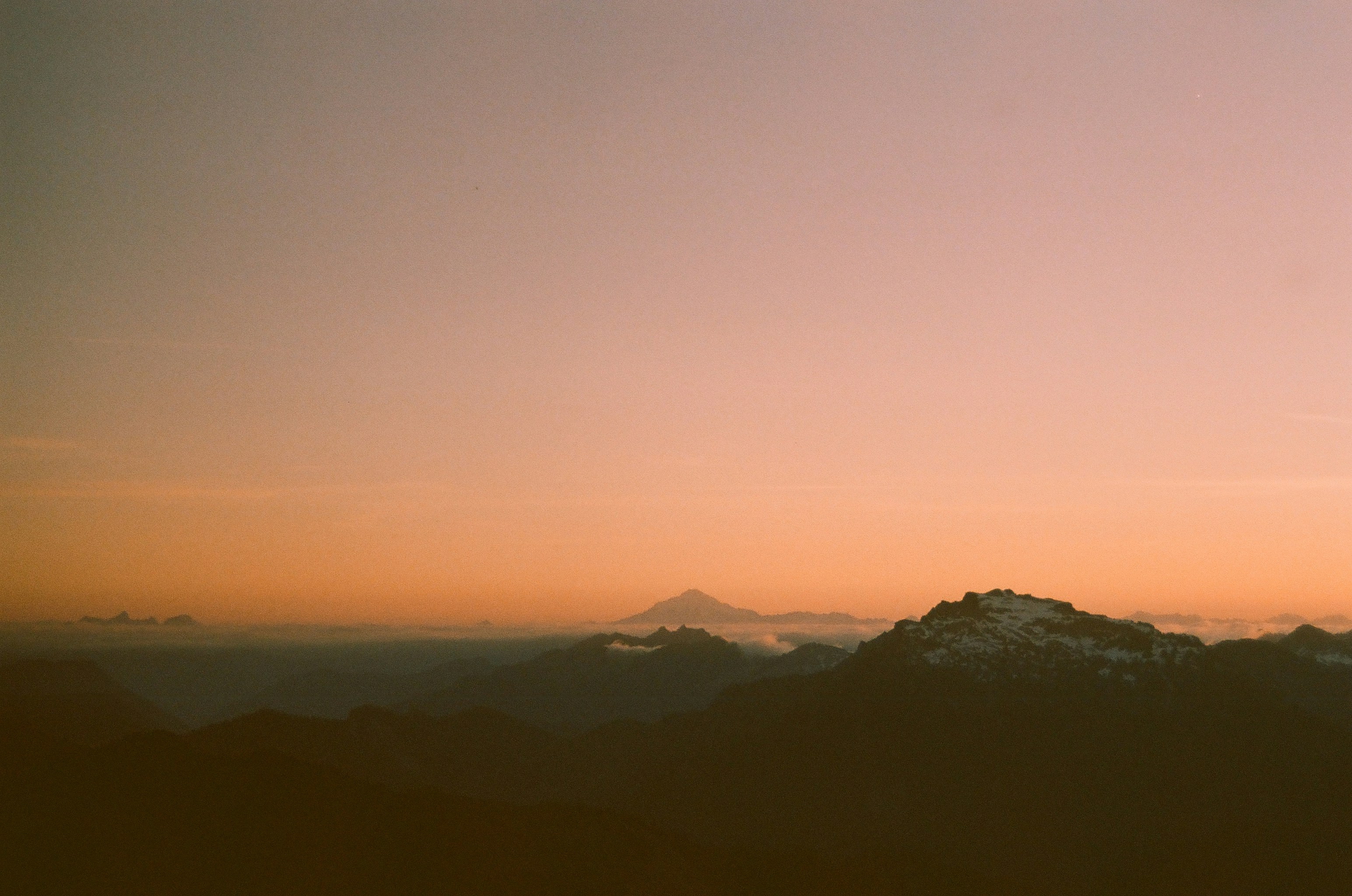 A view of a mountain range at sunset