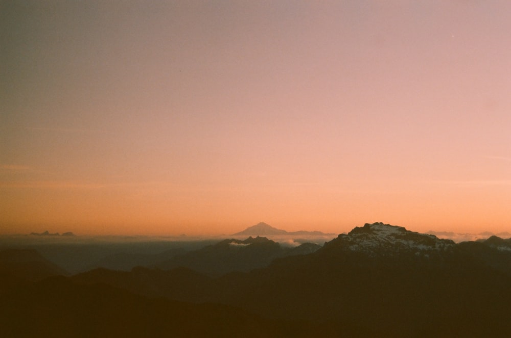 a view of a mountain range at sunset