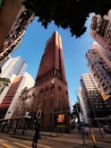 a tall building towering over a city filled with tall buildings