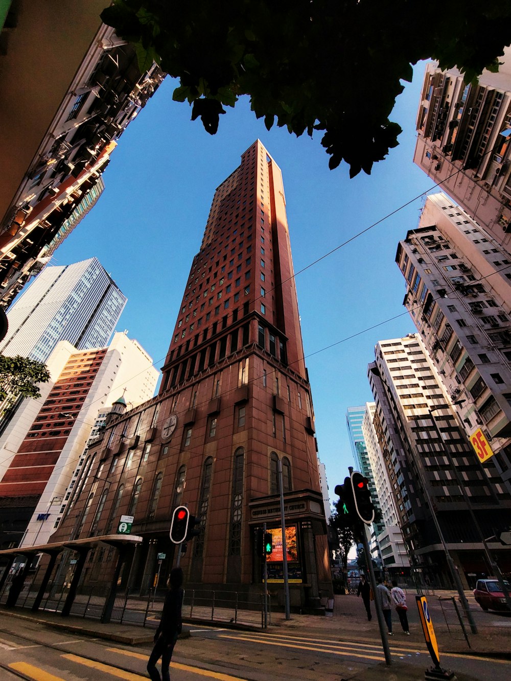 a tall building towering over a city filled with tall buildings