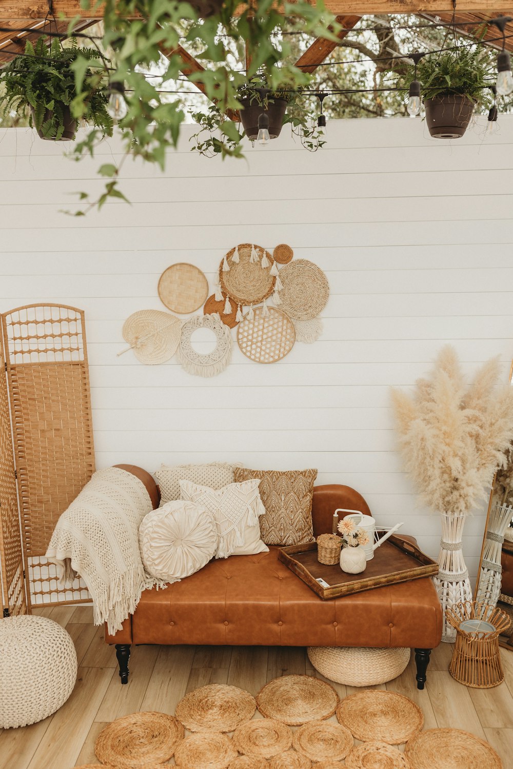 a living room filled with lots of furniture and decor