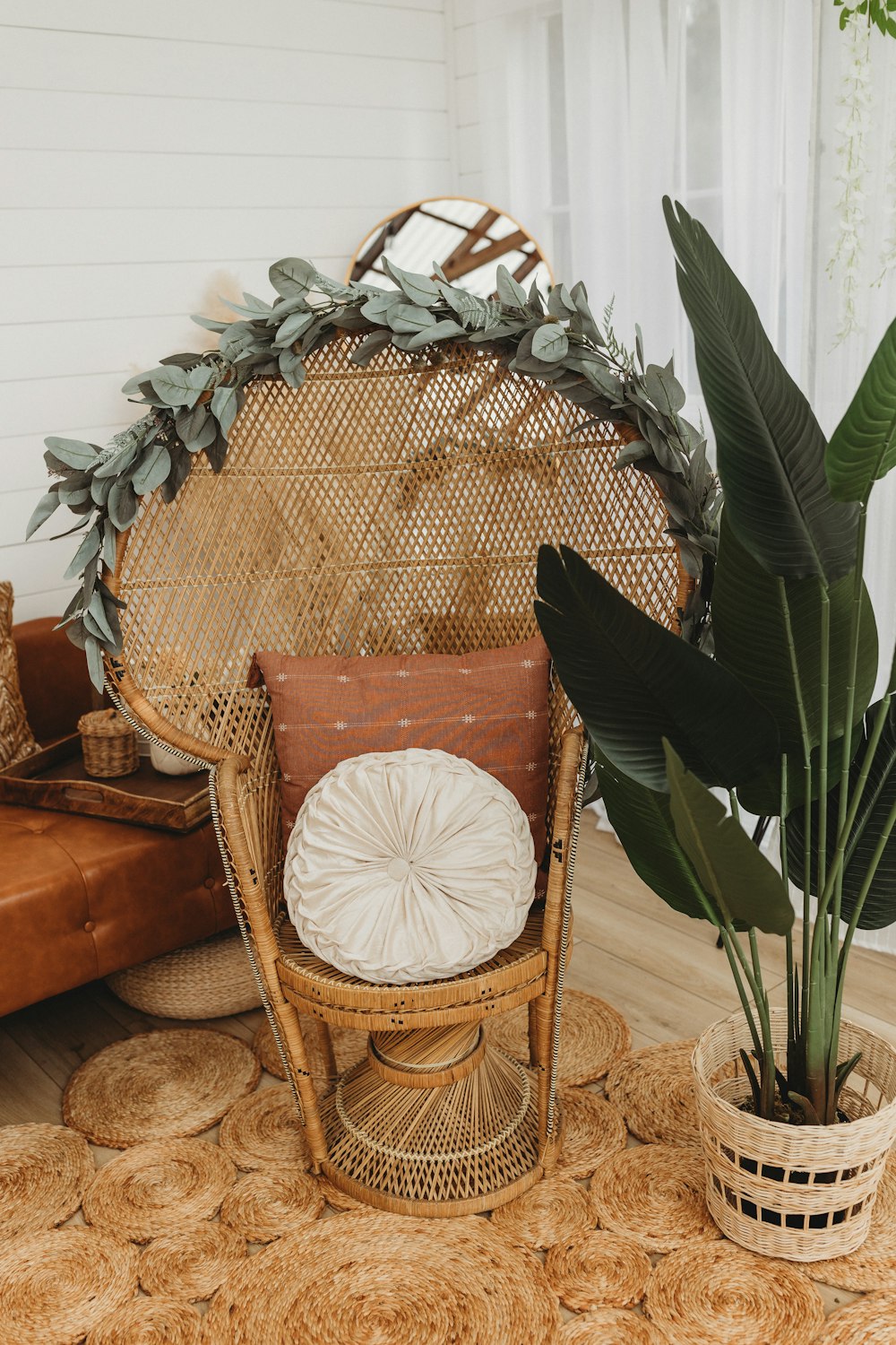 a wicker chair with a pillow on top of it