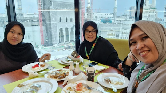 Happy Muslim family enjoying a halal meal during their Vietnam tour.
