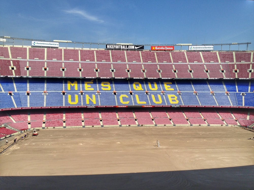 a stadium filled with lots of red and blue seats