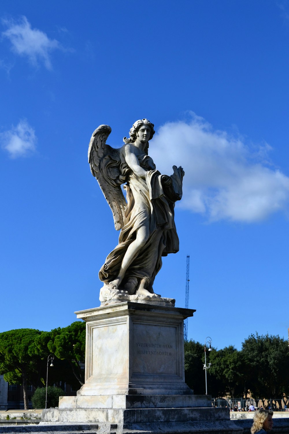 a statue of an angel on a pedestal
