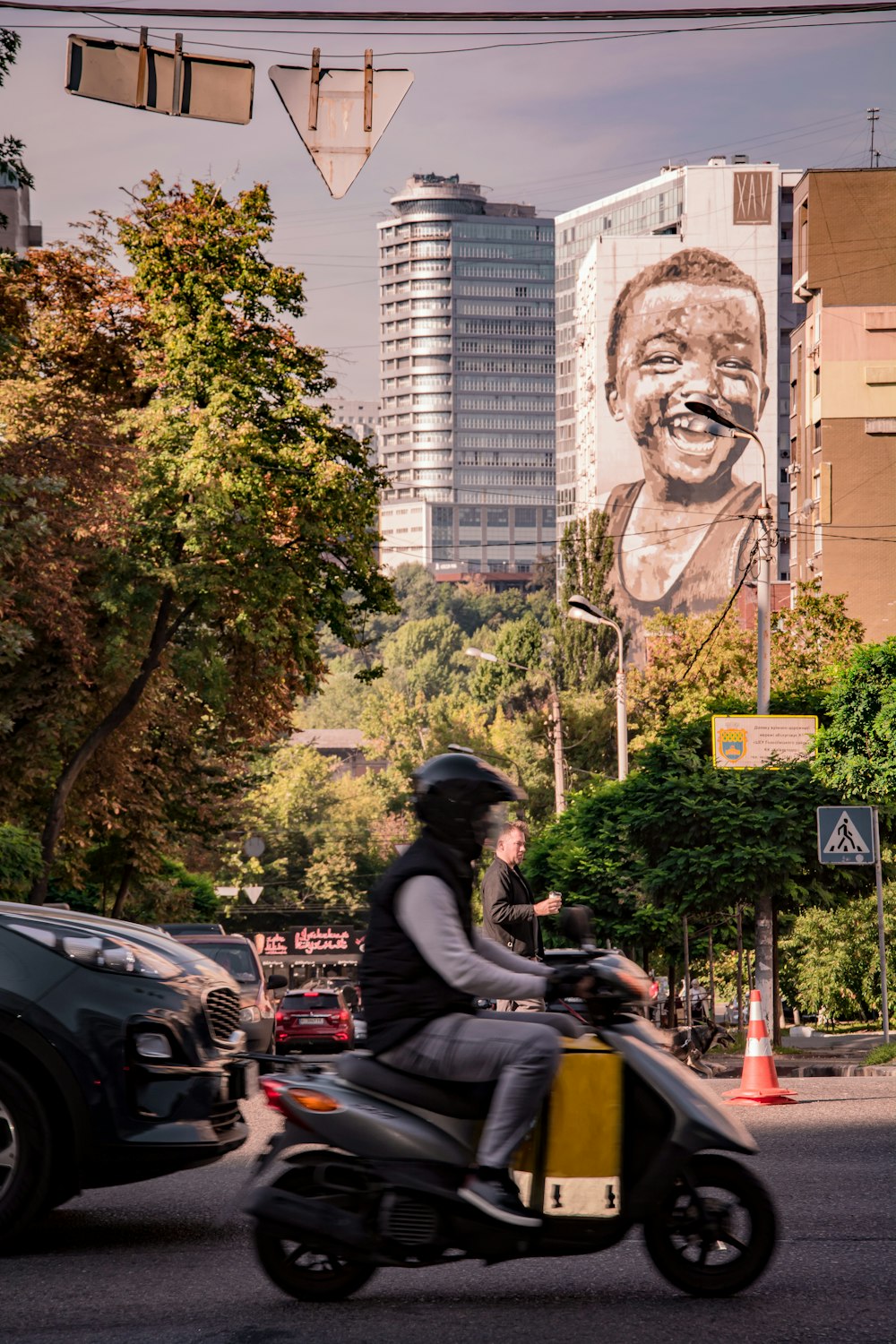 a person riding a motorcycle on a city street