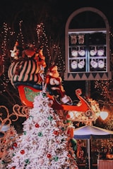 A festive scene of Santa's pop-up grotto decorated with lights and snow.