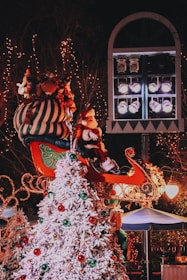 A festive scene of Santa's pop-up grotto decorated with lights and snow.