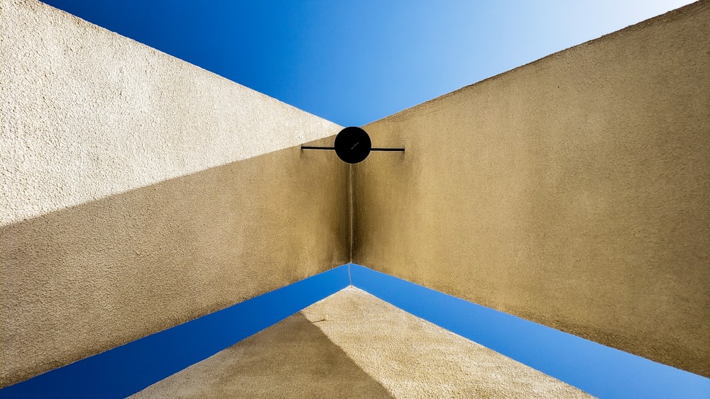 a corner of a building with a blue sky in the background