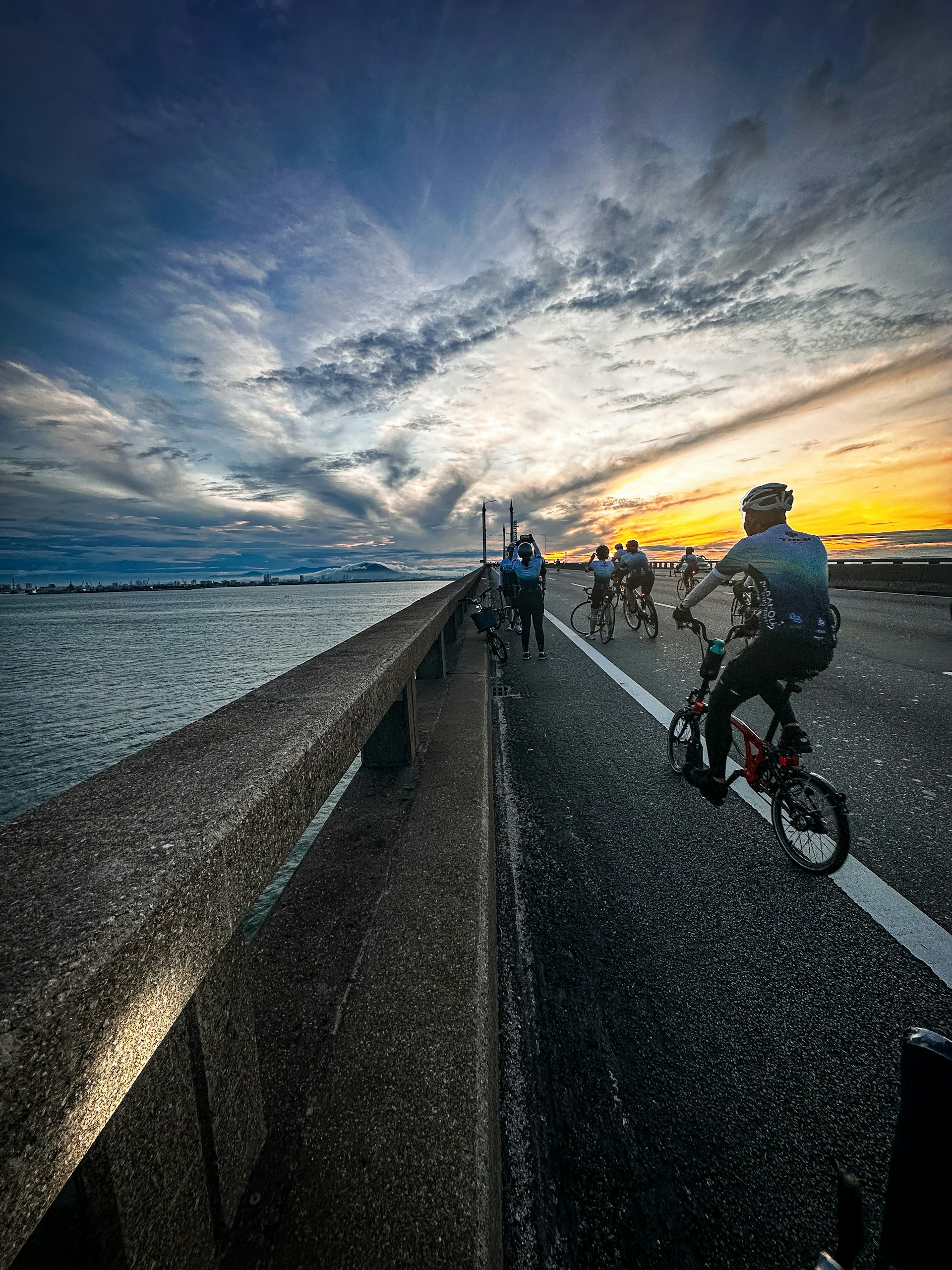 woman wearing yellow long-sleeved dress under white clouds and blue sky during daytime