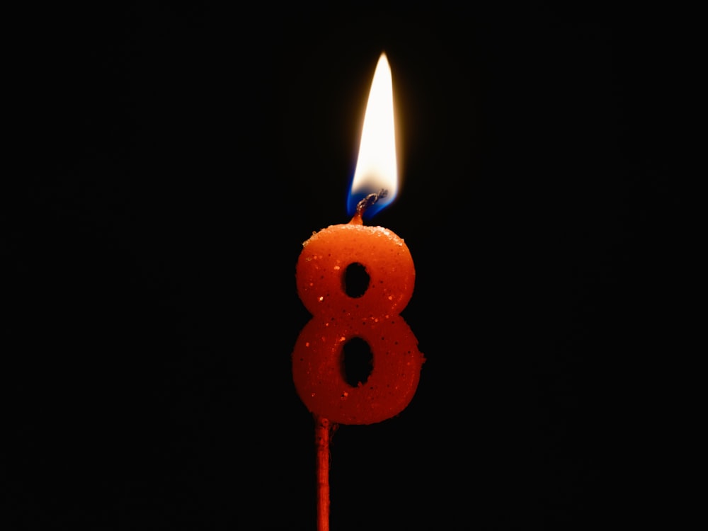 a birthday candle with the number eight on it
