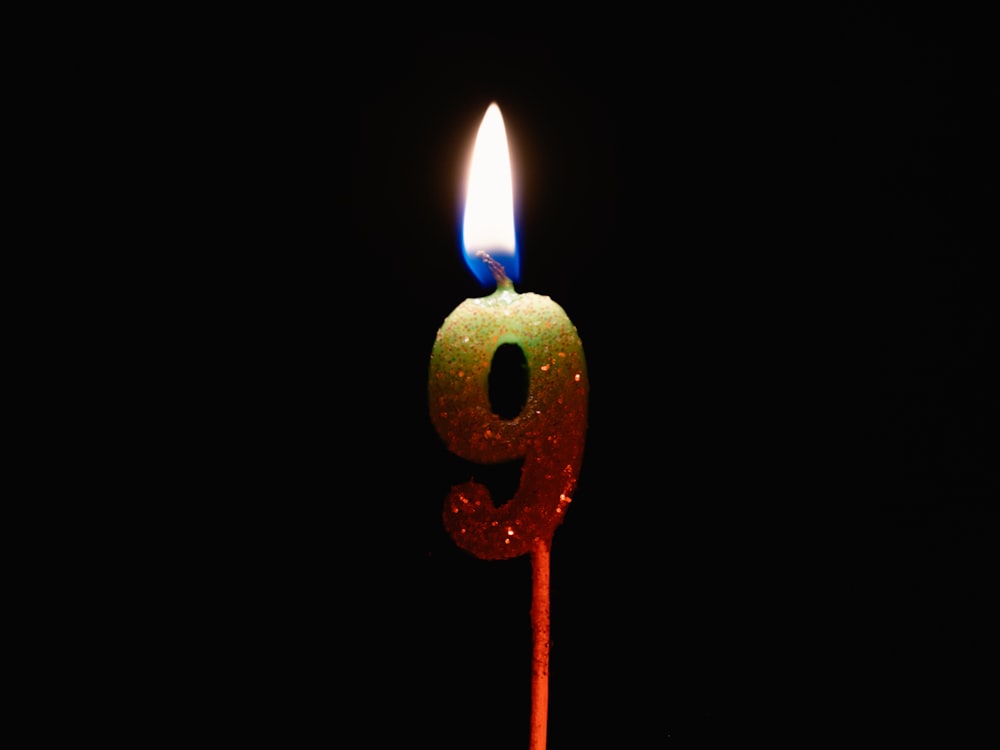 a birthday candle with a number 9 on it
