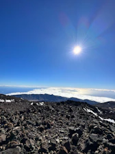 A panoramic view of Lesotho's high plateaus under a clear blue sky.