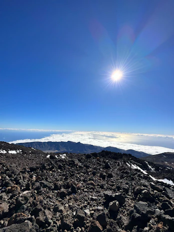 A panoramic view of Lesotho's high plateaus under a clear blue sky.