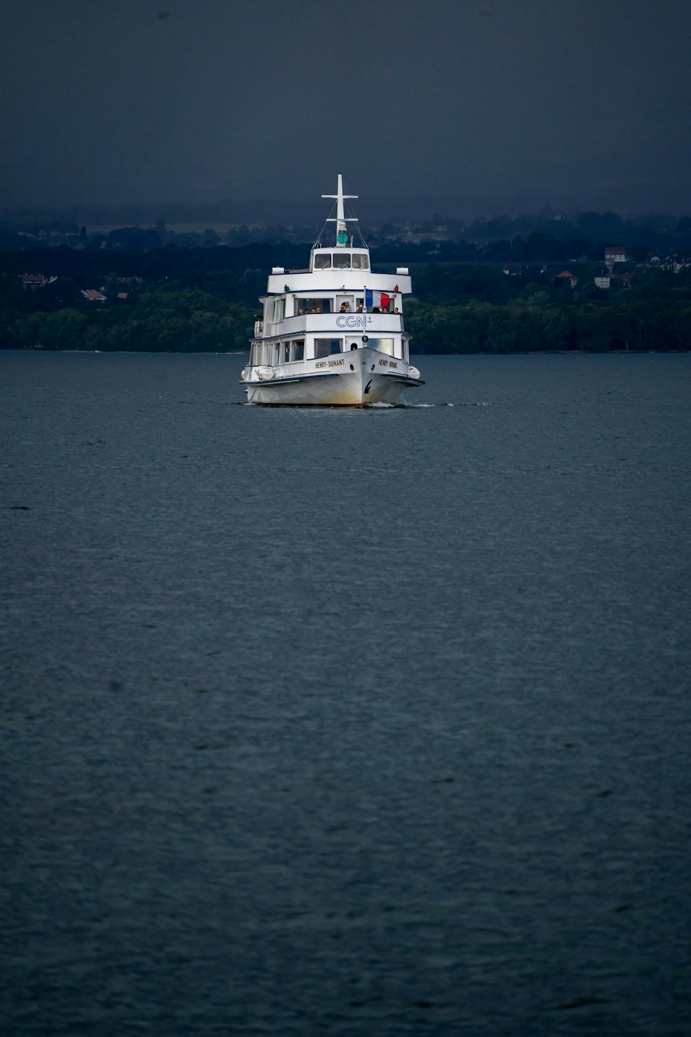 a large white boat floating on top of a large body of water