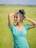 a woman standing in a field of tall grass