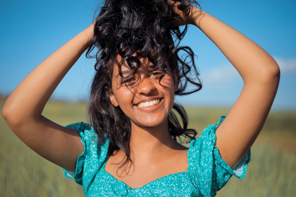 a woman with her hair in the wind