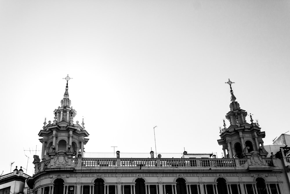 a black and white photo of a building with two towers